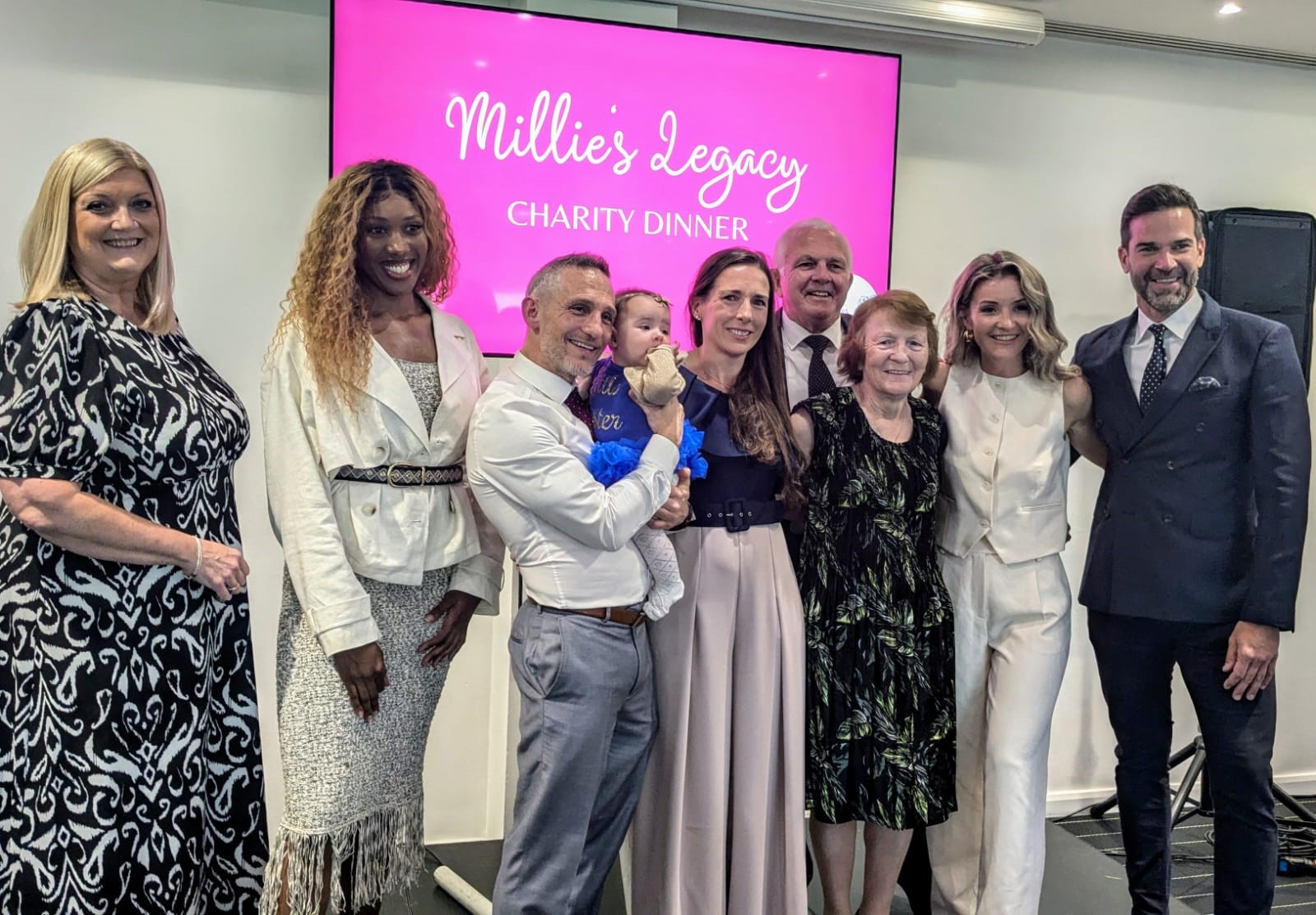 Guests smile for a photo at Millie's Legacy charity dinner